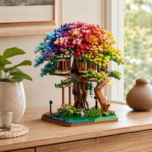 May include: A building block construction of a treehouse featuring a vibrant, multi-colored canopy transitioning from blue to purple, pink, red, orange, and yellow. The structure includes a brown trunk, a wooden swing, a staircase, and small animal figures.