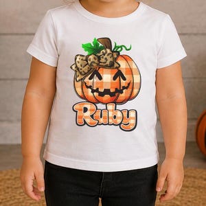 Personalized Girls Halloween Pumpkin Shirt, Leopard Bow Jack O Lantern, Custom Name Buffalo Plaid Trick or Treat Tee