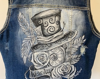 Dark denim vest, a little distressing, Mad Hatter design on back
