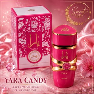 May include: A bright pink perfume bottle and matching rectangular box labeled Yara Candy Eau de Parfum 100ml. The bottle features gold accents and Arabic script, while the box displays a white floral pattern. The set is presented with pink flowers.
