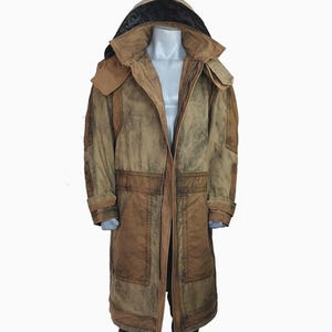 May include: A long, brown hooded coat with a distressed, weathered appearance. The coat features multiple pockets, a large hood, and a contrasting black lining. The coat is displayed on a mannequin.