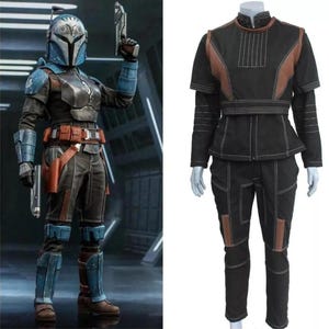 May include: A detailed action figure and a costume. The action figure is a warrior in a blue and gray helmet and armor, holding a blaster. The costume is black with brown accents and white stitching, including a jacket and pants.