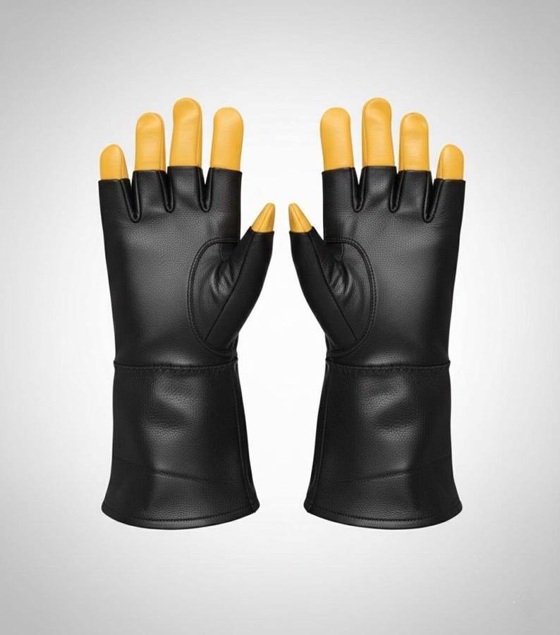 May include: A pair of black gloves with extended cuffs and yellow fingertips. The gloves feature a smooth, leather-like texture on the palms and back, with distinct yellow caps covering each finger and thumb, providing a contrast to the black body.
