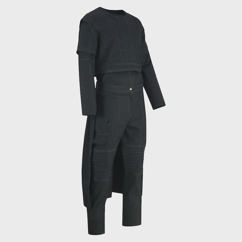 May include: A black two-piece outfit featuring a long-sleeved crop top and matching pants. The top has a crew neck and a layered design. The pants have cargo pockets and knee paneling. White stitching details the seams of the outfit.