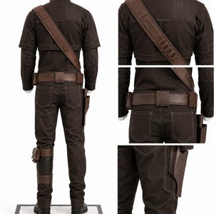 May include: A brown costume with a jacket, pants, and accessories. The jacket has a high collar and shoulder strap. The pants have pockets and a belt. The costume includes a holster and leg wraps. The outfit is displayed on a mannequin.