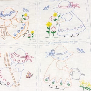 May include: A white fabric panel featuring four embroidered squares with outlines of children in sun hats. Scenes include a child on a tree stump, picking flowers, on a swing, and watering plants. The text JACK DEMPSEY NEEDLE ART 2013 is visible.