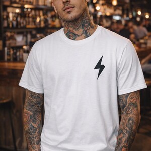 Stacked Books with Heart Lightning Bolt T-Shirt | D&R monogram