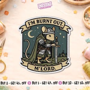 May include: Embroidered patch featuring a mouse in knight's armor holding a sword. The patch has the text "I'M BURNT OUT. M'LORD." in a banner design with a crescent moon and stars. The patch is green, beige, and black.