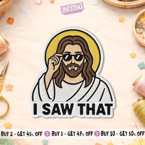 May include: An embroidered patch featuring a figure with long brown hair and a beard wearing black sunglasses and a white robe, set against a yellow circular halo. The text I SAW THAT is embroidered in bold black capital letters at the bottom.