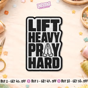 May include: Black and white embroidered patch with the text "LIFT HEAVY PRAY HARD". The patch features a rectangular shape with a white border and a design of praying hands. The patch is likely for clothing or accessories.