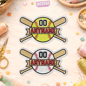 May include: Embroidered baseball patches. One features a yellow softball, the other a white baseball, both with the number "00" and the text "ANYNAME" on a banner. Each patch includes crossed baseball bats.