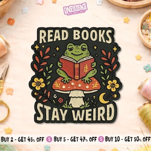 May include: Embroidered patch with a green frog reading a book on a mushroom. The patch reads "READ BOOKS STAY WEIRD". The design includes yellow flowers, leaves, and a crescent moon on a black background. A fun, quirky design.