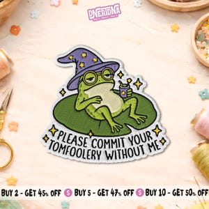May include: Embroidered patch featuring a green frog wearing a purple wizard hat and glasses, holding a drink. The patch reads "PLEASE COMMIT YOUR TOMFOOLERY WITHOUT ME" in white text. The patch is on a green lily pad.