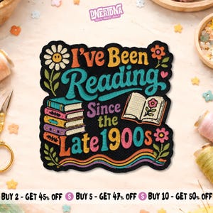 May include: A black embroidered patch featuring the text I've Been Reading Since the Late 1900s in colourful lettering. The design includes a stack of books, an open book with a flower, a daisy, and wavy lines at the bottom in shades of orange, blue, and pink.