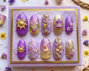 May include: A set of ten purple press-on nails with gold accents. Designs include a sun, a lantern, floral braids, and glitter. The nails are arranged on a lavender background with decorative elements.