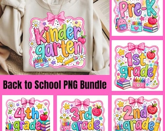 May include: A beige sweatshirt featuring a colorful graphic print with the text Kindergarten, surrounded by illustrations of a pink bow, daisies, stars, a red apple, a pencil, and a box of crayons. The design is part of a school-themed collection.