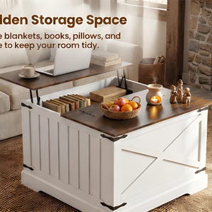 May include: A white and brown lift-top storage coffee table with the text "Hidden Storage Space". The table has a white base with a wooden top and a hidden storage compartment. The top is open, revealing books and a basket of fruit.