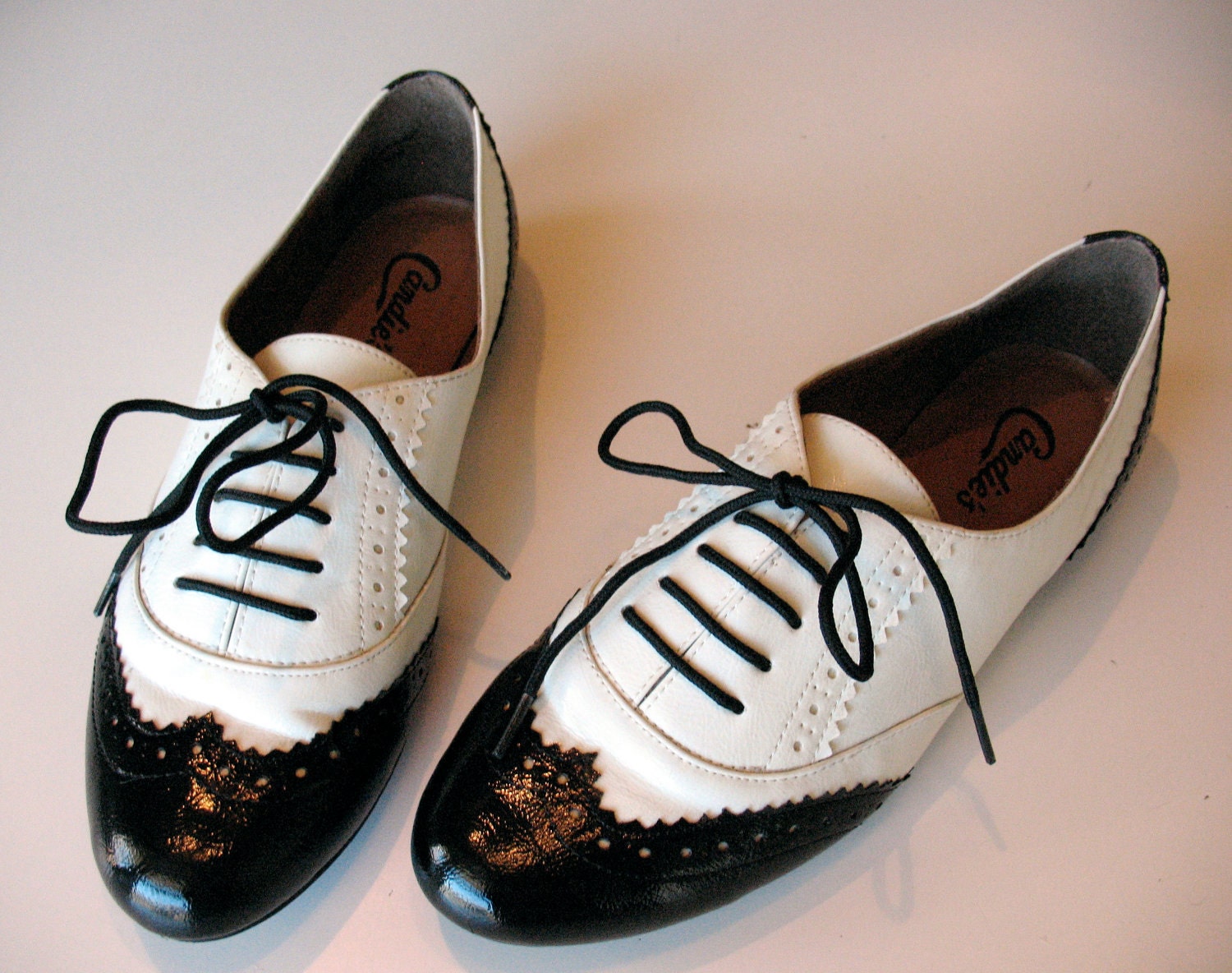 black and white wing tip heels