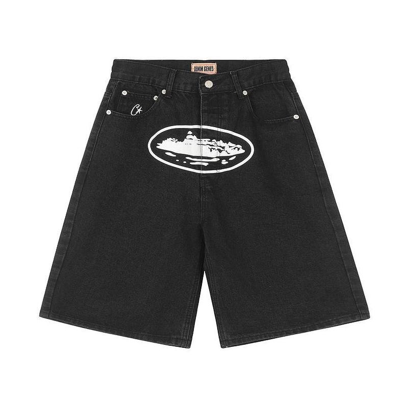 May include: Black denim shorts featuring a high-waisted cut, a button and zipper fly, and silver-tone rivets. A large white oval graphic depicting a ship is centered on the front. A small white star logo is on the coin pocket, with a Denim Genes label.