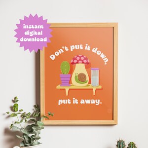 May include: Orange background with the text "Don't put it down, put it away."  A cartoon snail is on a mushroom with a cactus in a pot on a shelf.
