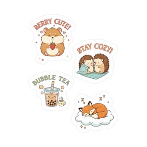 May include: Four cute stickers with illustrations. One shows a hamster holding a strawberry with the text "Berry Cute!". Another depicts two hedgehogs under a blanket with "Stay Cozy!". A bubble tea cup is shown with "Bubble Tea". A sleeping fox is on a cloud.