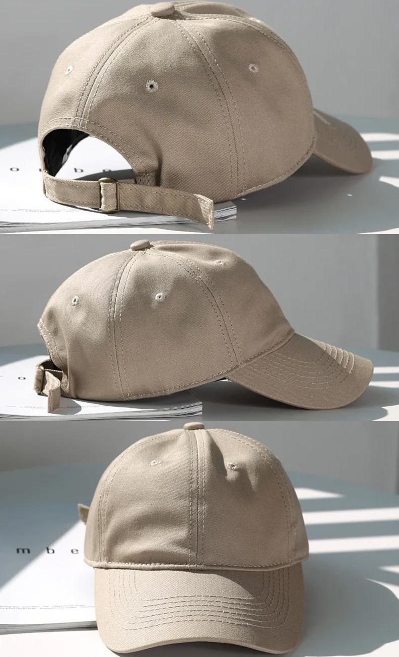 May include: A tan baseball cap with a curved brim and adjustable strap. The cap is made of a solid-colored fabric and features a structured crown with a button on top. The adjustable strap has a metal buckle.