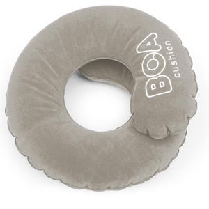 May include: A gray, inflatable travel pillow with a circular design and a central opening. The pillow has the text "BOA cushion" printed in white on the side. The pillow is designed for neck support.