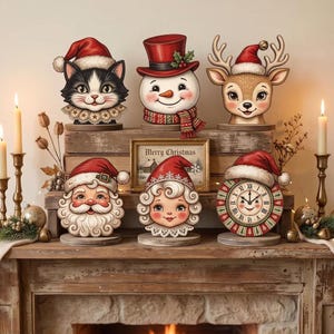 May include: A collection of six Christmas-themed tabletop decorations featuring a cat, snowman, reindeer, Santa Claus, a child, and a clock, all wearing Santa hats. A framed sign with the text Merry Christmas sits in the center of the display.