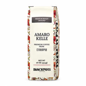 May include: A rectangular bag of medium roast ground coffee labeled Amaro Kelle Premium Coffee from Ethiopia. The packaging is cream-colored with a colorful patterned border and the Blackpots Coffee logo. It states a net weight of 16 oz (454g).