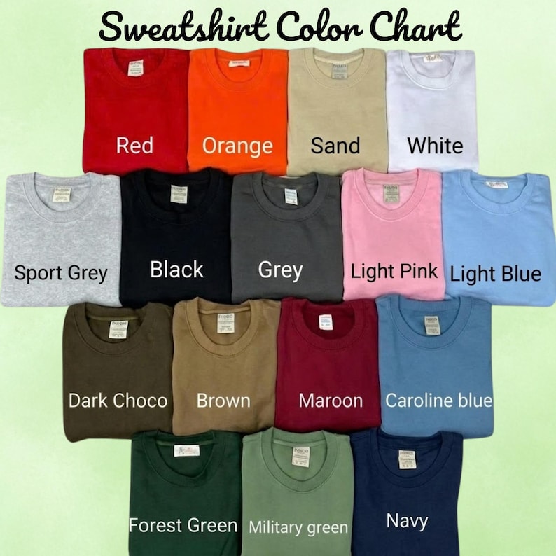 May include: A sweatshirt colour chart displaying fifteen folded crewneck sweatshirts in various colours including red, orange, sand, white, sport grey, black, grey, light pink, light blue, dark choco, brown, maroon, caroline blue, forest green, military green, and navy.