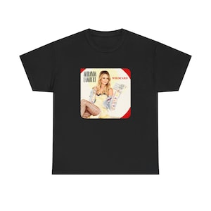 May include: A black t-shirt featuring a square graphic print on the chest. The print displays a photograph of Miranda Lambert with the text Miranda Lambert and Wildcard. The image shows a person in a yellow dress, denim jacket, and fishnet stockings.