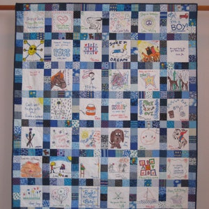 May include: A blue and white patchwork quilt with squares featuring hand-drawn illustrations and messages. The quilt is made of fabric squares sewn together to create a larger design. The squares feature a variety of colors, including blue, white, red, green, yellow, and orange. The illustrations are simple and childlike, and the messages are often celebratory or congratulatory. The quilt is a beautiful and unique piece of art that would be a treasured heirloom.