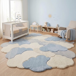 May include: A large, irregularly shaped area rug featuring a repeating pattern of soft, plush clouds in shades of cream, light blue, and soft gray. The rug has a textured, tufted surface and covers a significant portion of the wooden floor.