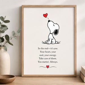 Puede incluir: Una lámina artística enmarcada con un dibujo lineal en blanco y negro de un perro mirando hacia un corazón rojo. Debajo de la ilustración aparece el texto: In the end—it's you. Your heart, your soul, your energy. Take care of them. You matter. Always.