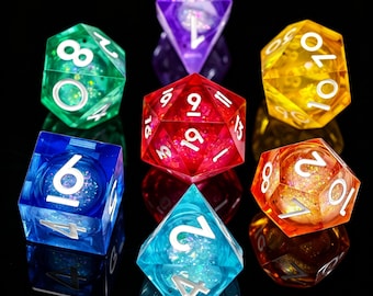 May include: A set of multi-coloured, translucent polyhedral dice. The dice are in various shapes and colours, including green, purple, red, blue, yellow, and orange. Each die has white numbers and glitter inside, ideal for tabletop games.