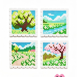 May include: Four square pixel art stamps depicting spring scenes. Each stamp features a different landscape: a tree with green leaves, a field with a river, a path through a field of flowers, and a cherry blossom tree. The stamps have a scalloped edge.