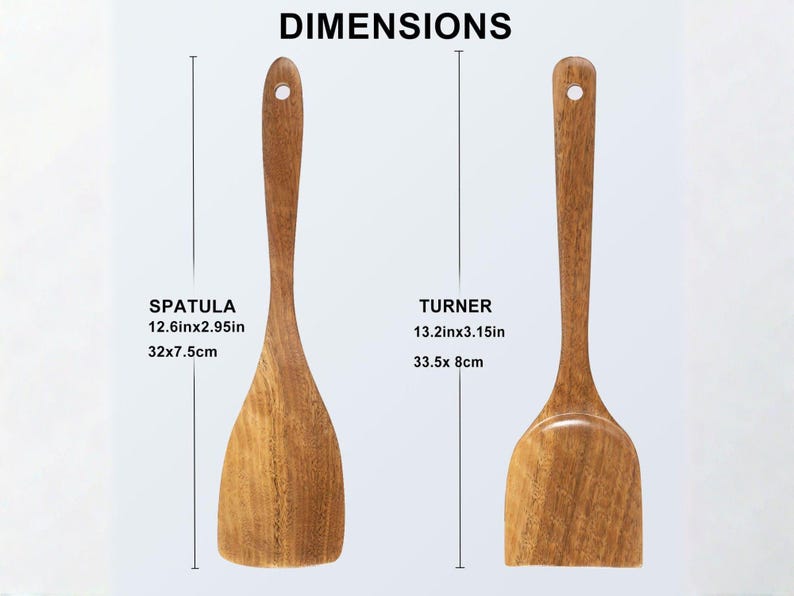 May include: Two wooden kitchen utensils: a spatula (32 x 7.5cm) and a turner (33.5 x 8cm). Both have a natural wood grain finish and a hole in the handle for hanging. The image includes dimensions in inches and centimeters.