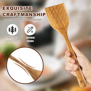 May include: Wooden spatula with a wide, rectangular head and a long handle. The spatula is made of natural wood with a visible wood grain. The image includes text that reads "EXQUISITE CRAFTSMANSHIP MADE BY NATURAL WOOD".
