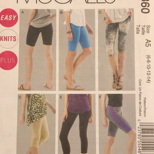 May include: A sewing pattern for women's knit leggings. The pattern includes five different styles of leggings, including black, blue, beige, and grey. The pattern is for sizes 6-8-10-12-14. The pattern is called McCall's M6360.