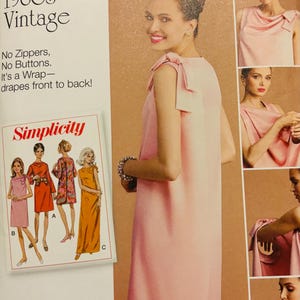 May include: Simplicity sewing pattern 8049 for a 1960s vintage wrap dress. The pattern features a sleeveless design with shoulder ties, no zippers, and no buttons. The envelope displays illustrations of three dress variations in pink, orange, and floral.