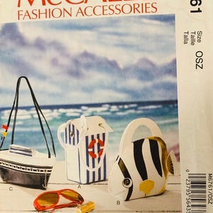 May include: McCall's Fashion Accessories pattern featuring three novelty bags: a boat, a striped tote with a life preserver, and a fish-shaped purse. Also included are red sunglasses and a gold-colored tube. The pattern is size OSZ.