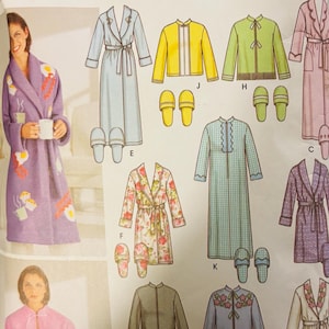 May include: Simplicity pattern featuring designs for 12 great looks, including robes and jackets. The image shows various robe styles, including a purple robe with egg and coffee cup designs, and a pink jacket. The pattern includes sizes BB L, XL.