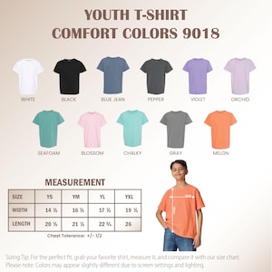 May include: A display of youth t-shirts in various colors, including white, black, blue jean, pepper, violet, orchid, seafoam, blossom, chalky, gray, and melon. The image includes a size chart with measurements in inches and a young person wearing a melon-colored shirt.