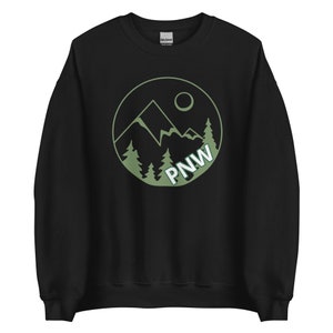 May include: Black sweatshirt with a green circle graphic featuring a mountain range, trees, and the text "PNW".