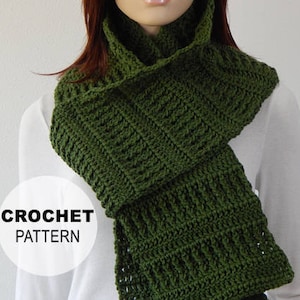 May include: A green crocheted scarf with a simple stitch pattern. The scarf is folded and draped around a person's neck. The text "CROCHET PATTERN" is visible in the image.