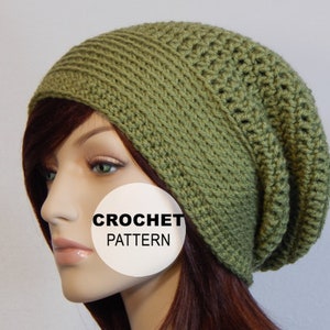 May include: A green crocheted beanie hat with a slouchy fit. The hat is made with a simple stitch pattern and has a ribbed brim. CROCHET PATTERN is written on a white circle in the image.