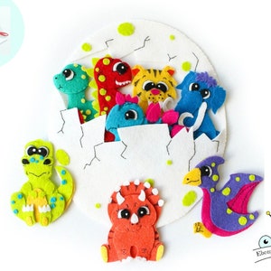 May include: A felt craft kit featuring a white egg with a cracked opening, revealing a variety of colorful felt animals, including a green dinosaur, a red dinosaur, a blue dinosaur, a yellow tiger, a blue elephant, a purple dinosaur with wings, and a green dinosaur with yellow spots.