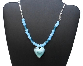Lampwork heart necklace, blue heart with striped swirls of black & white, blue Swarovski crystals, cats eye glass, silver plated chain