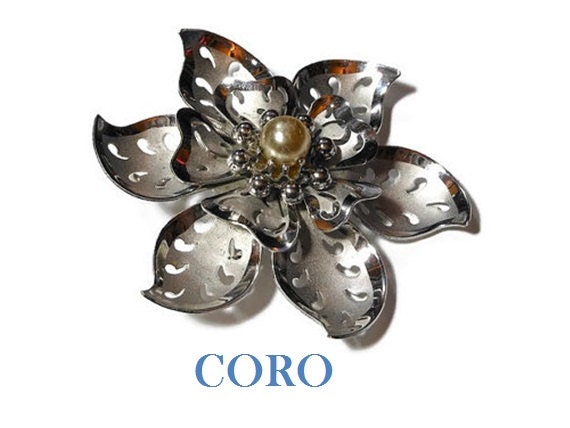 1940s Coro brooch and pendant, silver flower with cut out leaves in satin and brushed silver with silvered pearl center.