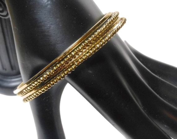 Gold bangle bracelets, set of four stacking bangles, 2 plain 2 with raised ball design